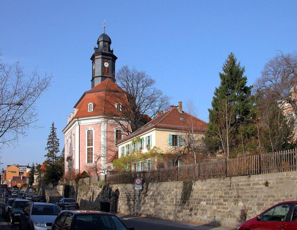 Loschwitz church in Dresden with old rose facade, mansard roof and bell-shaped dome